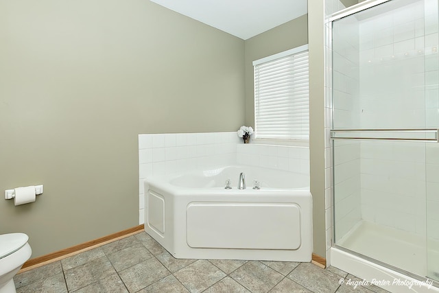 bathroom featuring toilet, independent shower and bath, and tile patterned flooring