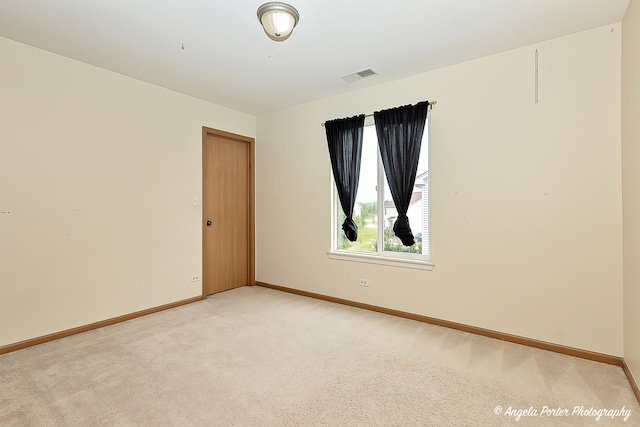 empty room with light colored carpet