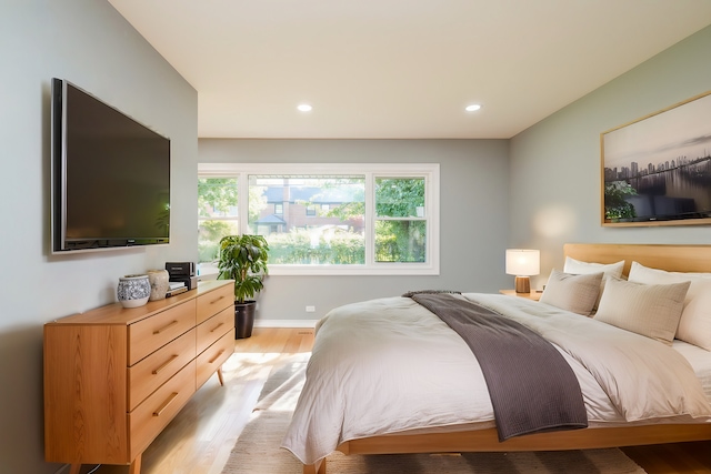 bedroom with light hardwood / wood-style flooring