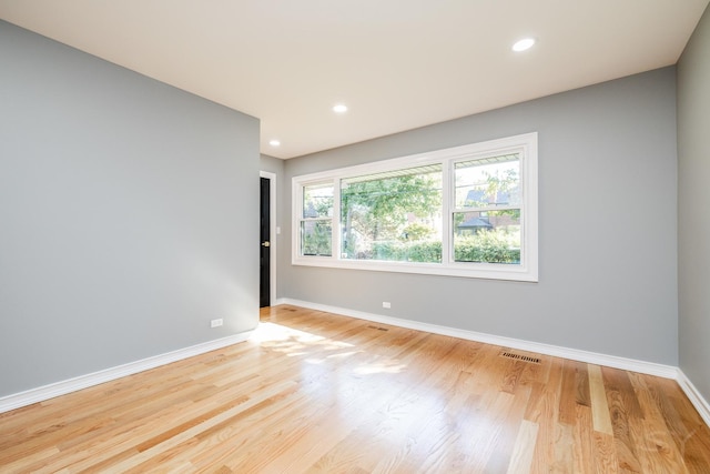 unfurnished room featuring light wood-type flooring