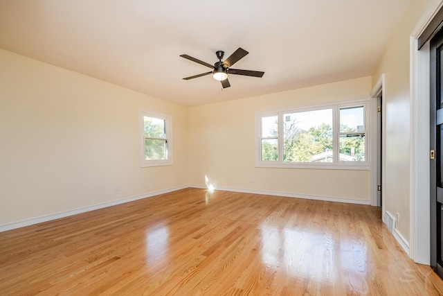 unfurnished room featuring ceiling fan and light hardwood / wood-style floors