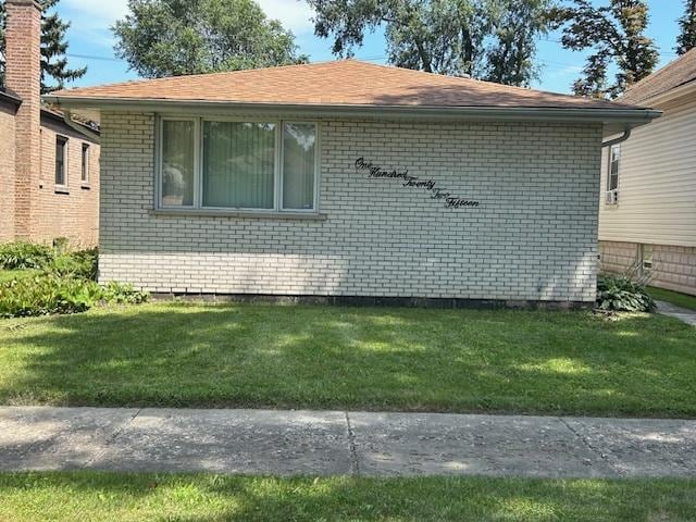 view of property exterior with a lawn