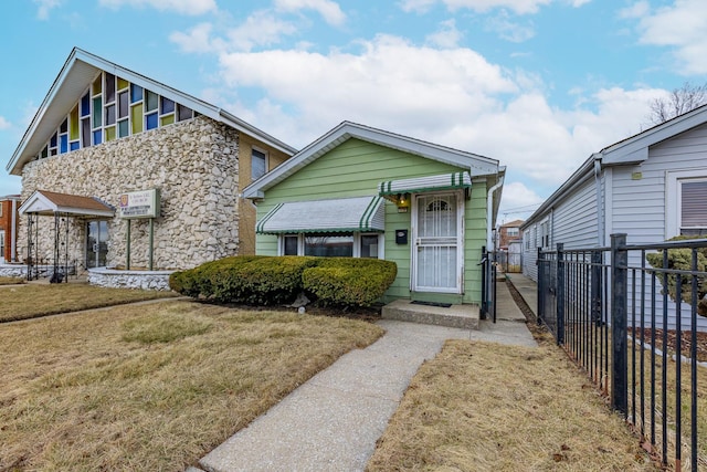 view of front of home with a front lawn