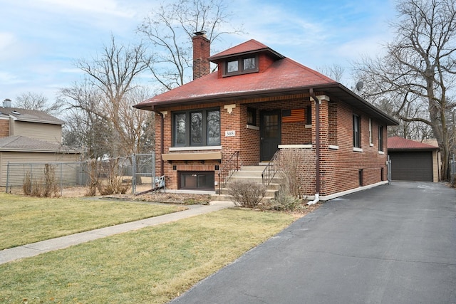 view of front of home featuring a garage and a front lawn