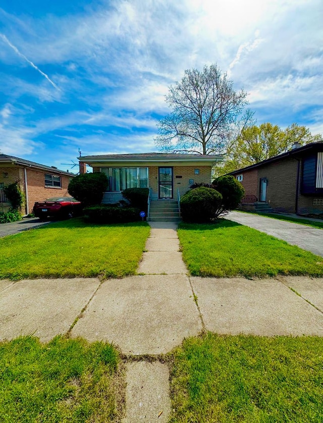 14333 Drexel Ave, Dolton, IL 60419 - view of front of property featuring a front yard and brick siding