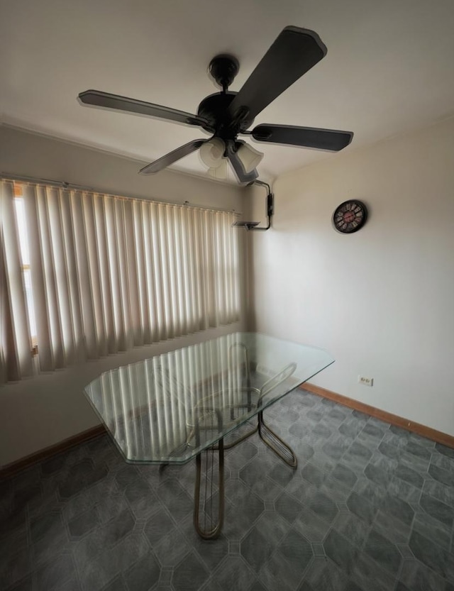 interior space with ceiling fan