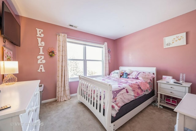 bedroom featuring light carpet