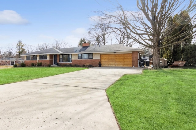 ranch-style house with a garage and a front lawn