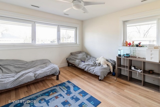 bedroom featuring ceiling fan and light hardwood / wood-style flooring