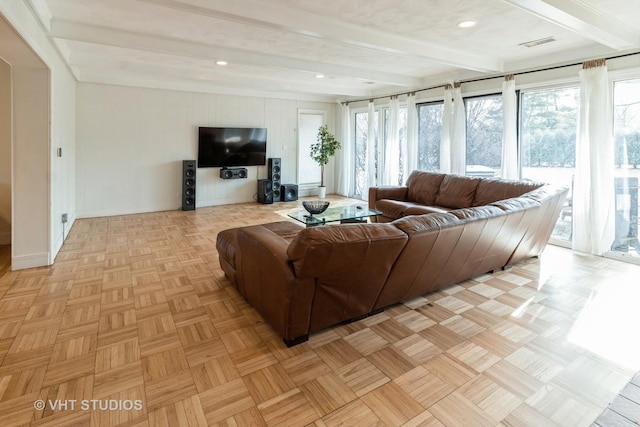 living room featuring beam ceiling and light parquet flooring