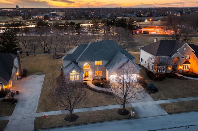 view of front of home with a garage and concrete driveway