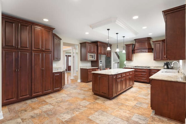 kitchen featuring premium range hood, a sink, appliances with stainless steel finishes, and recessed lighting