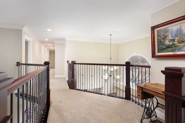 corridor featuring baseboards, crown molding, an upstairs landing, carpet floors, and recessed lighting