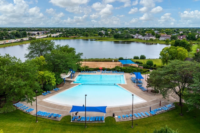 view of swimming pool with a water view