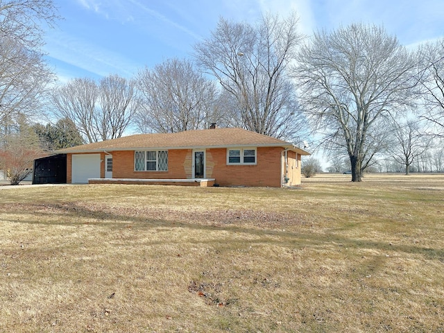 ranch-style home with a garage and a front lawn