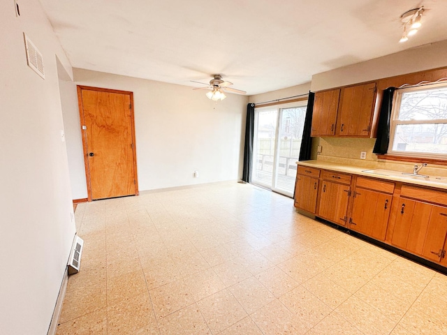 kitchen featuring sink and ceiling fan