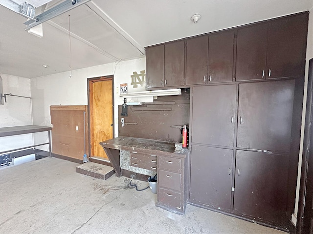 kitchen featuring dark brown cabinets