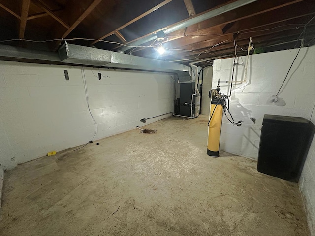 basement featuring heating unit