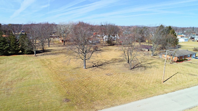 birds eye view of property with a rural view