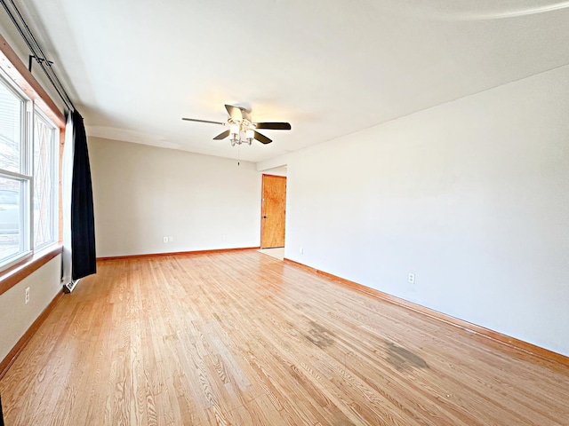 unfurnished room with ceiling fan and light hardwood / wood-style floors