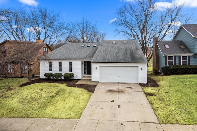 view of front of property featuring a garage and a front lawn