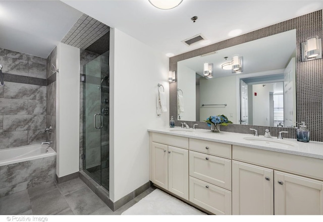 bathroom with vanity, tile patterned flooring, and plus walk in shower