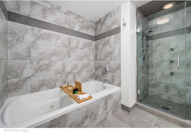 bathroom with separate shower and tub