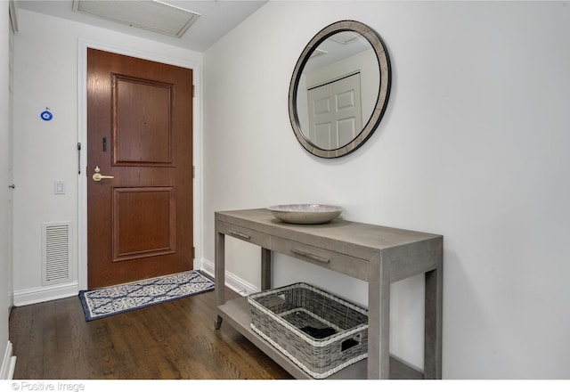 entrance foyer with dark hardwood / wood-style floors