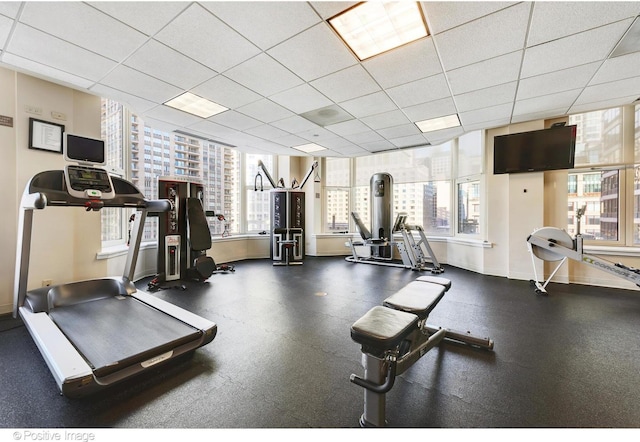 exercise room with a drop ceiling