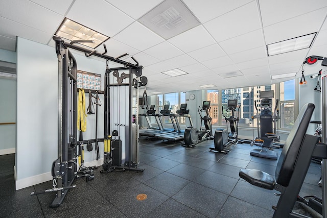 gym featuring a drop ceiling