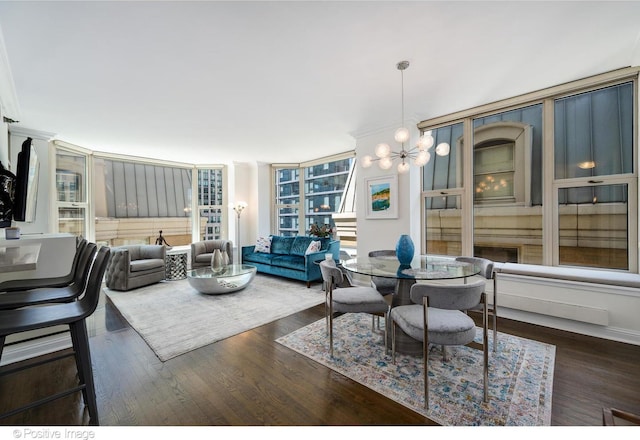 dining area featuring dark wood-type flooring, floor to ceiling windows, and a chandelier