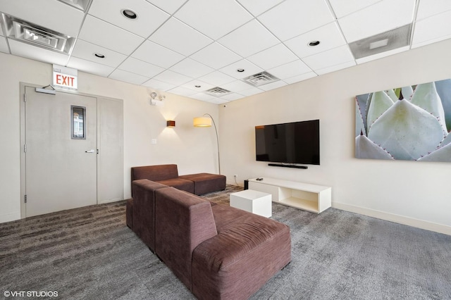 carpeted living room featuring a paneled ceiling