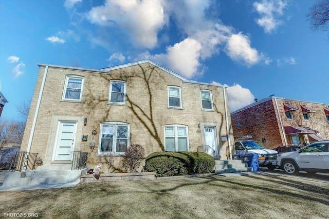 view of front of property featuring brick siding