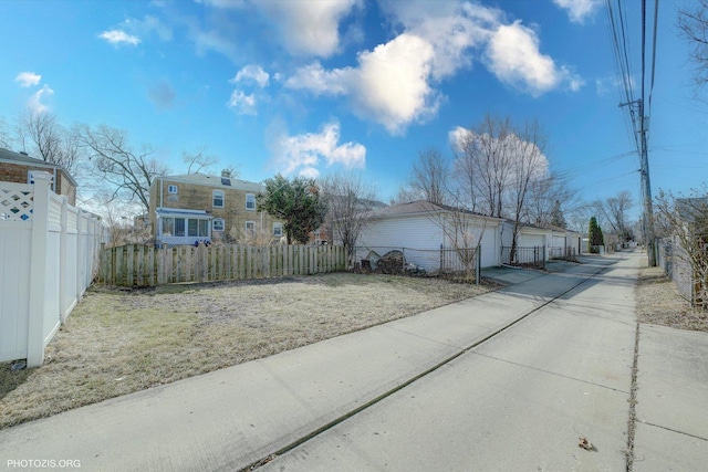 view of side of property featuring fence