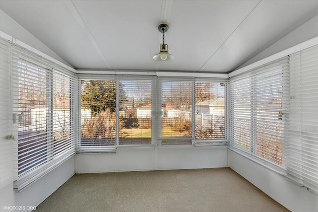 unfurnished sunroom with vaulted ceiling