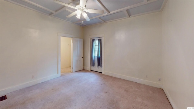 carpeted empty room featuring ceiling fan and coffered ceiling