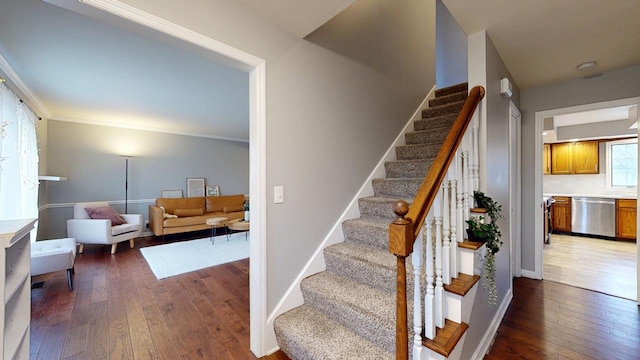 stairs with hardwood / wood-style floors