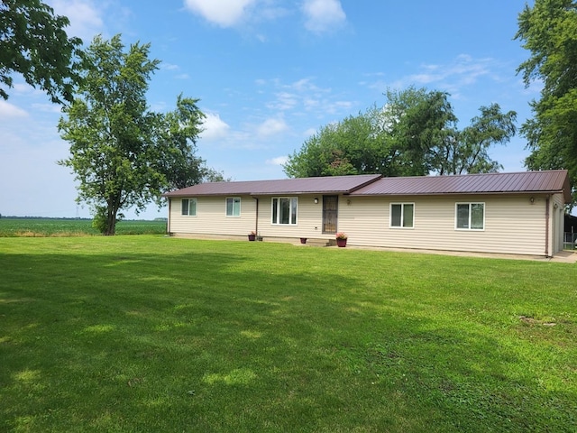 ranch-style home with a front lawn