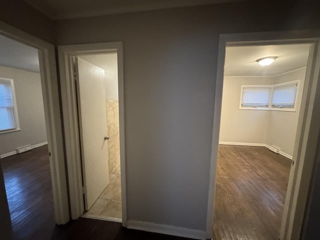 corridor featuring dark hardwood / wood-style flooring