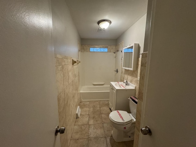 full bathroom featuring tile walls, vanity,  shower combination, toilet, and tile patterned floors