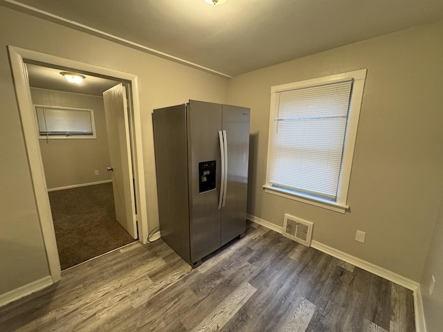 kitchen featuring stainless steel refrigerator with ice dispenser and dark hardwood / wood-style flooring