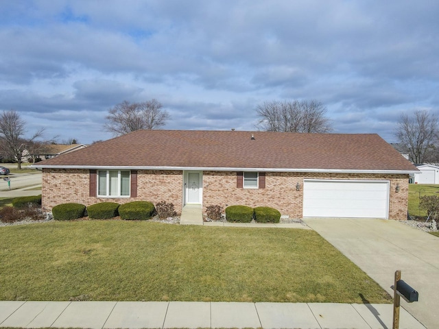 ranch-style house featuring a garage and a front lawn