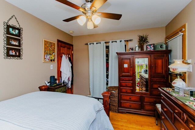 4551 W Foster Ave, Chicago, IL 60630 - bedroom with ceiling fan and light wood-type flooring