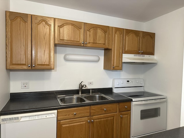 kitchen with sink and white appliances