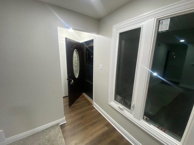 hallway with dark wood-type flooring