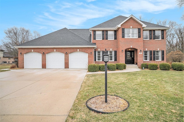 view of front of house with an attached garage, a front lawn, concrete driveway, and brick siding