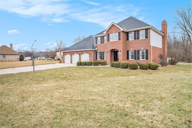 colonial house featuring a front yard, concrete driveway, brick siding, and an attached garage