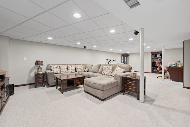 living area with light carpet, visible vents, and recessed lighting