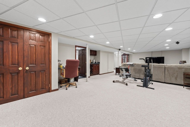 workout room featuring recessed lighting, baseboards, and light carpet