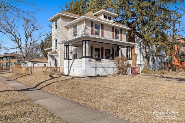 view of front of property with a front yard and a porch